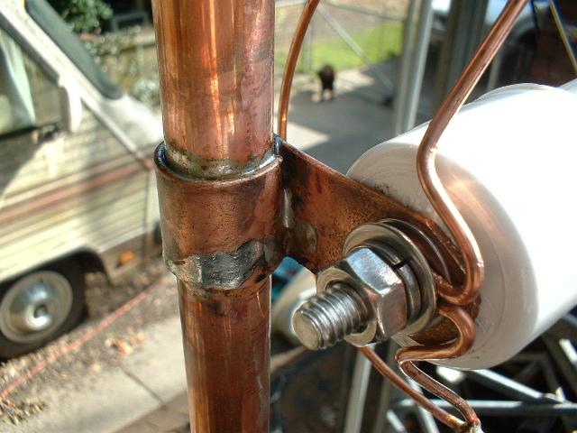 Corona ring and support on side arm